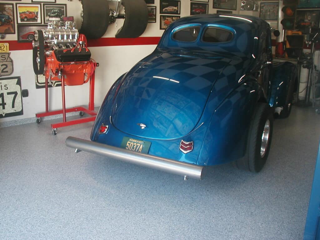 Classic bug car in garage with concrete floor coating