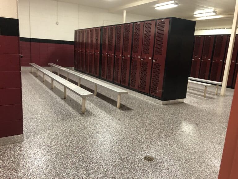 Gym locker room with concrete floor coating