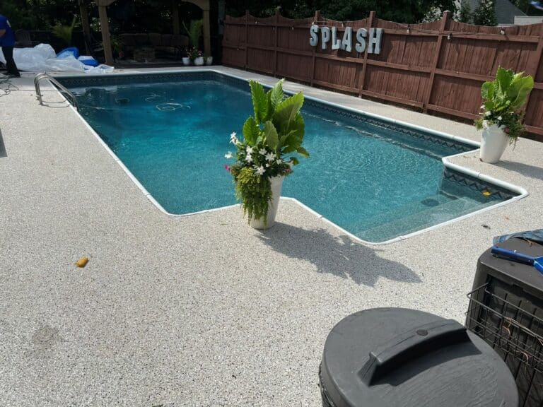 Pool deck with concrete floor coating