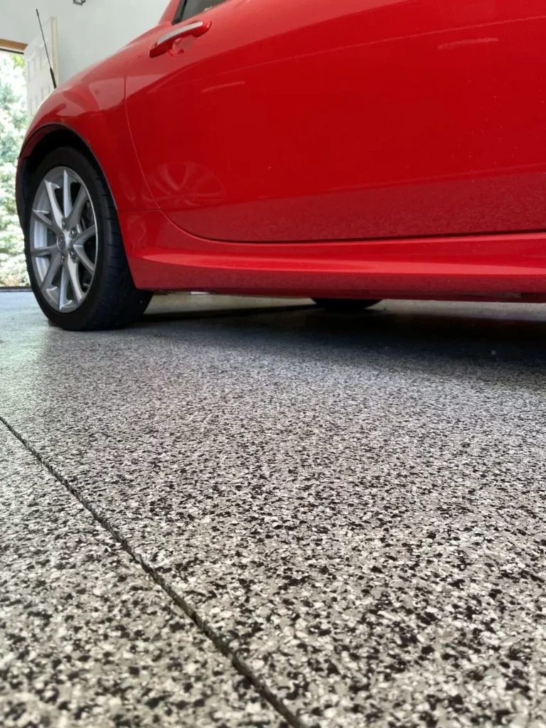 Red car on Domino color concrete floor coating